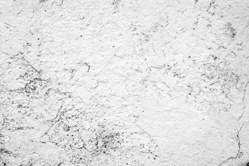 Texture of a concrete wall with cracks and scratches which can be used as a background