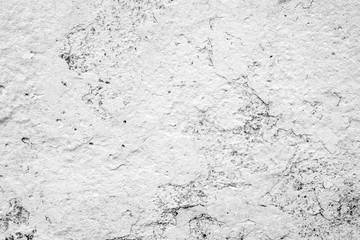 Texture of a concrete wall with cracks and scratches which can be used as a background