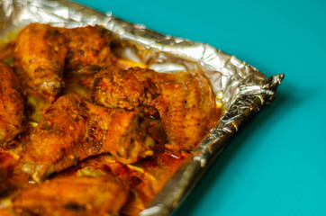 Roasted chicken wings marinated in a spicy peri-peri sauce