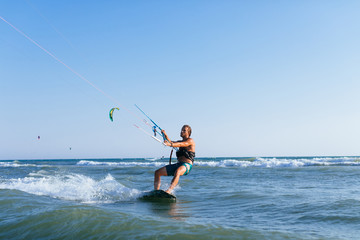 Man Kitesurfing on the Sea