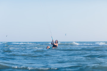 Man Kitesurfing on the Sea