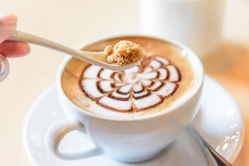 Add sugar to hot coffee