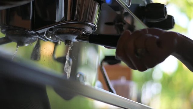 Cleaning portafilter group head in coffee blending machine with back flushing hot water
