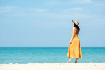 Summer Holiday. Lifestyle woman chill with yellow wearing dress fashion summer trips standing chill...