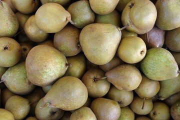 close up of pears on display at the market