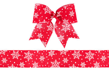 Red burlap ribbon and bow with snowflakes isolated on white background