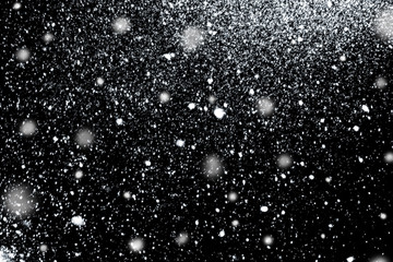 Falling Snow on a black background. Winter snow background.