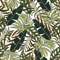 Fashionable seamless tropical pattern with bright green and brown plants and leaves on a light background.  Beautiful seamless vector floral pattern. Exotic jungle wallpaper.