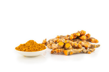 fresh turmeric root and turmeric powder in spoon on white background