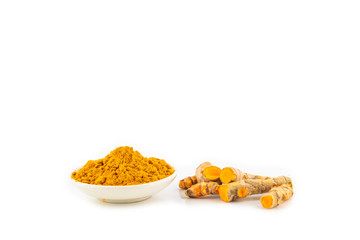 fresh turmeric root and turmeric powder in spoon on white background