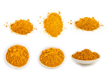 fresh turmeric root and turmeric powder in spoon on white background