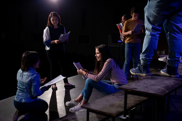 Teenagers rehearsing in a theatre