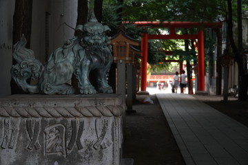 a japanese sculpture besides a path