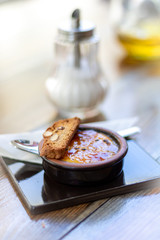 Catalan cream (Creme Brulee) with carquinyolis, typical dessert in Nort Spain, Catalonia