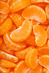 Lots of slices of juicy tangerines as background texture.