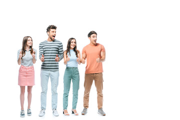 Obraz premium surprised friends screaming and showing thumbs up isolated on white