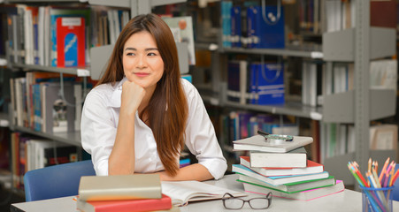 young female student in the library