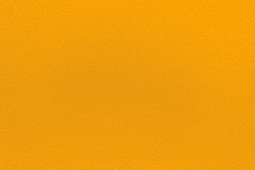 Fashionable saffron pantone color of spring-summer 2020 season from New York fashion week. Texture of colored porous rubber. Modern luxury background or mock up with space for text