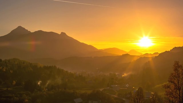 Sunset at the picturesque village in the middle of the mountains 4K Time Lapse