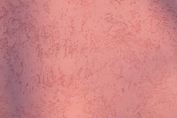 Pink stucco concrete wall for background. Vintage pastel pink plaster.