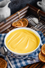 A bowl with orange curd. Pastry cream