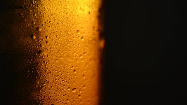 beer bottle with drops of water spins