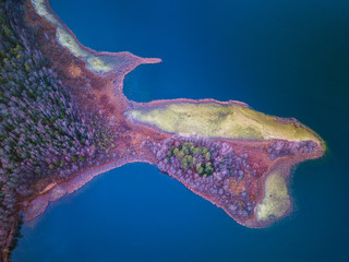 Aerial view over the lake with capes and bendings