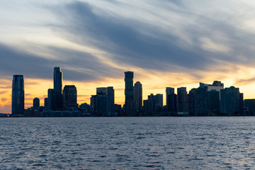 Fototapeta premium Jersey City Skyline along the Hudson River during a Sunset