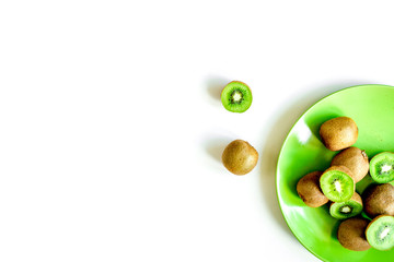 fresh green fruits with kiwi on white background top view mock-up