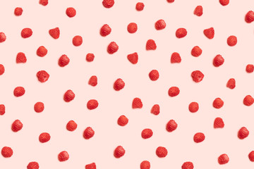 Juicy ripe red raspberry berries pattern on a pink background. Healthy Food and Nutrition