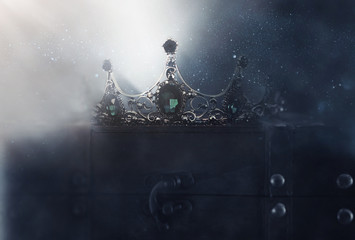 mysterious and magical photo of of beautiful queen/king crown over gothic dark background. Medieval...