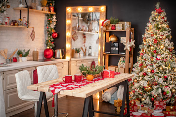 kitchen decorated with pine garlands and Christmas toys.