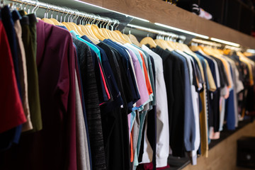 Obraz premium Stand with various clothes in clothing boutique