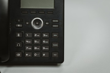 Obraz premium Close up keypad number ip phone devices at office desk,Cocept business work.