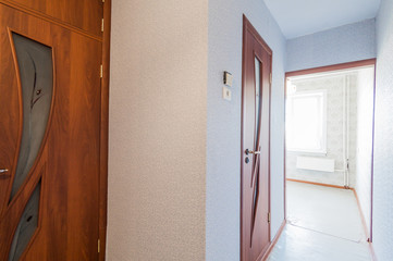 Russia, Moscow- August 01, 2019: interior room apartment. standard repair decoration in hostel. room doors, repair corridor