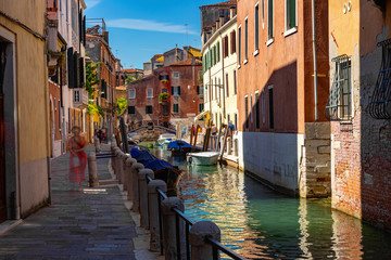 Fototapeta na wymiar Panorama of Grand canal with boats and gondolas on sunny summer day in Venice. Italy