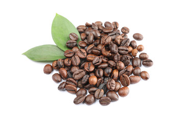 Heap of coffee beans and leaves isolated on white background, close up
