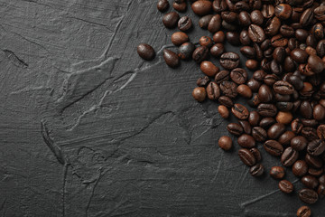 Frame of coffee beans on black background, space for text