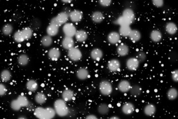 Texture of white snow blurry bokeh isolated black background. falling snow overlay. star sky. Black spots on white background, white drops and spots