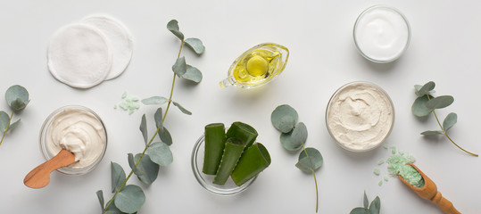 Eco cream products of aloe vera, olive oil and sea salt on white