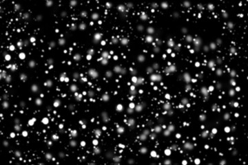 Texture of white snow blurry bokeh isolated black background. falling snow overlay. star sky. Black spots on white background, white drops and spots