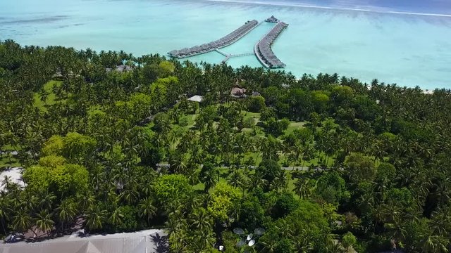 Drone view to the island in the midle of the ocean with blue lagoon 4K