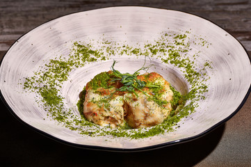 restaurant dish on white and gray plates, on a table