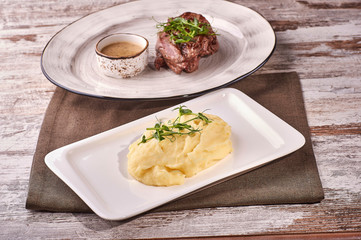 restaurant dish on white and gray plates, on a table