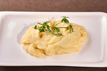restaurant dish on white and gray plates, on a table