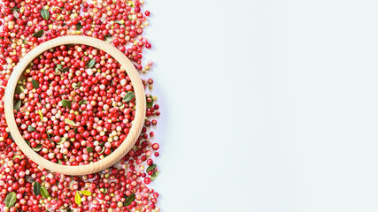ripe fresh cranberries in a wooden bowl top view. copy space. cranberries are flat lying.