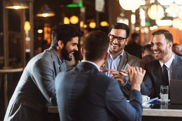 Group of male business people have meeting