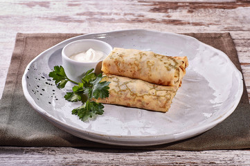 restaurant dish on white and gray plates, on a table
