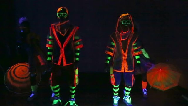 Dance group in neon costumes