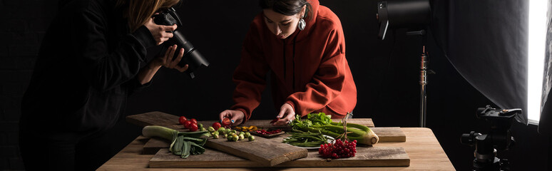 photographers making food composition for commercial photography and taking photo on digital camera, panoramic shot